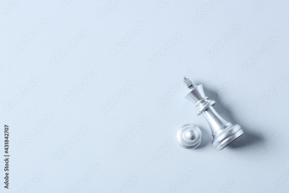 Silver king and pawn on light background Silver king and pawn on light background