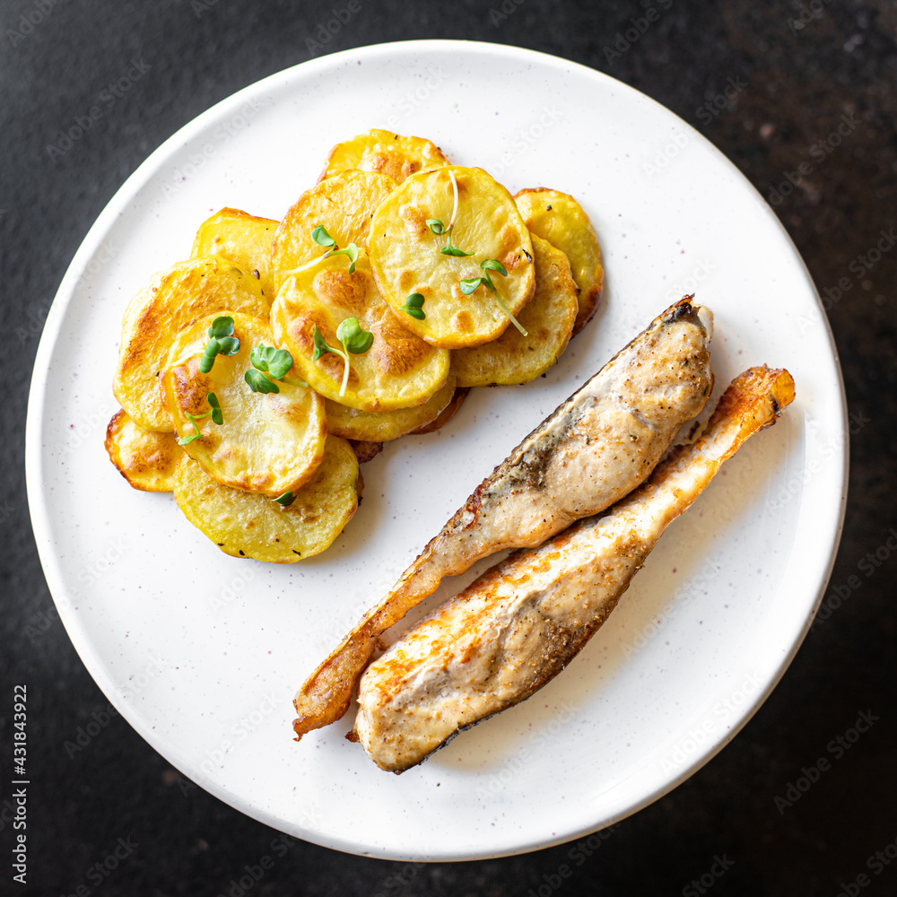baked fish and potato fried slice garnish seafood omega diet meal snack copy space food background rustic top view baked fish and potato fried slice garnish seafood omega diet meal snack copy space food background rustic top view