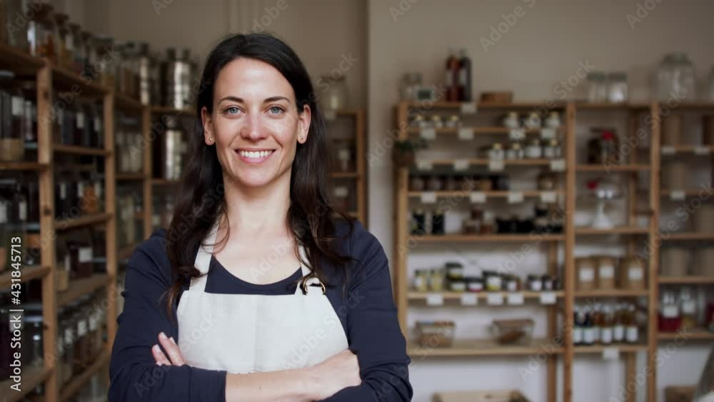 Female owner of zero waste shop, looking at camera. Female owner of zero waste shop, looking at camera.