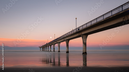Obraz na płótnie Sunset and moon rise at the same time at New Brighton Pier, Christchurch, New Zealand w salonie