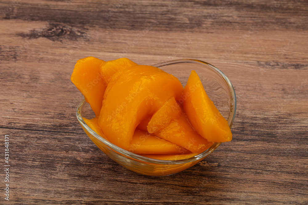 Sweet mango slices in syrop Sweet mango slices in syrop