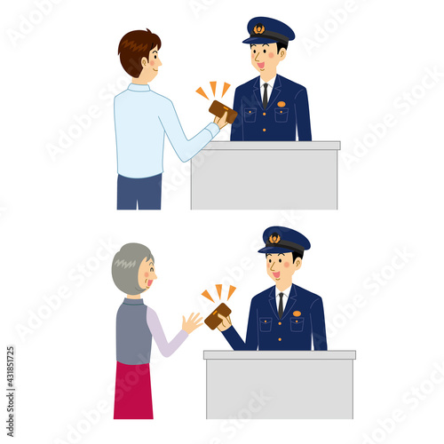 落とし物の手続きをする警察官
