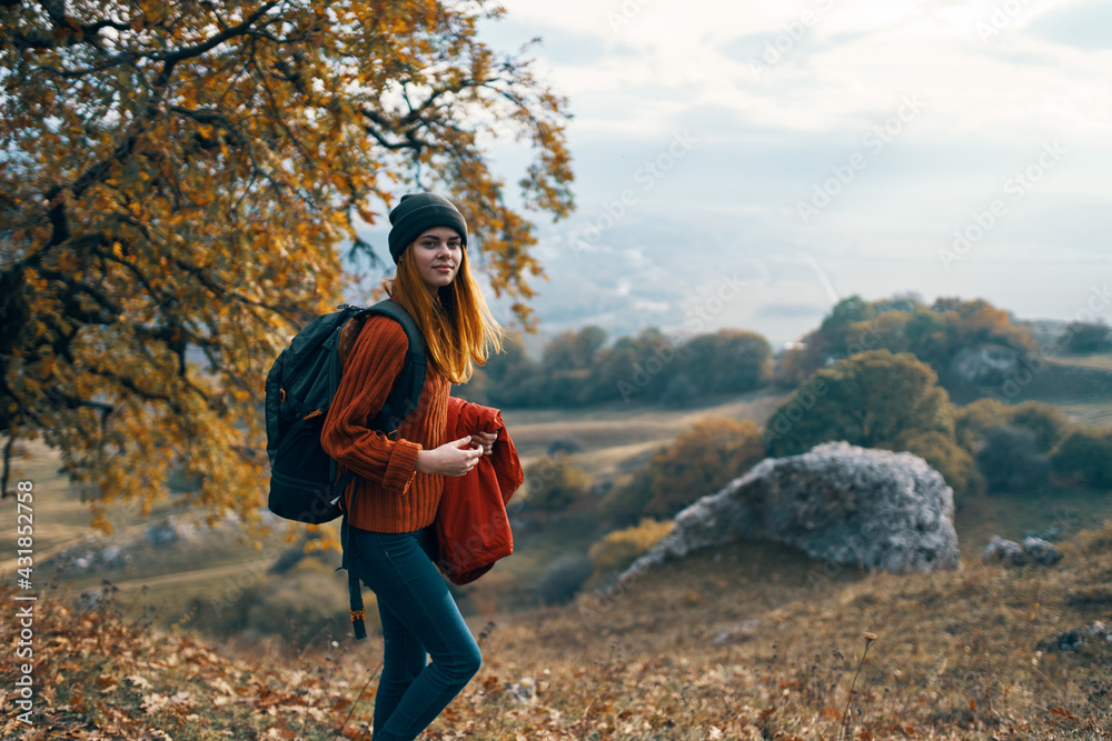 Naklejka premium woman hiker backpack in travel mountains autumn lifestyle