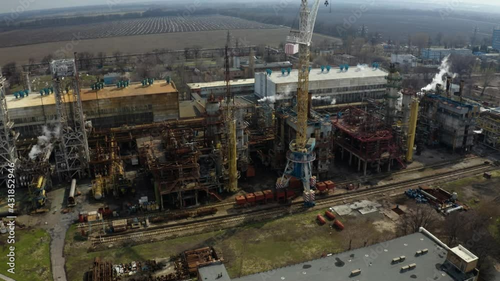 Chemical processing plant. Aerial view of Modern high-tech production. A giant chemical plant. A huge oil refinery with pipes and distillation of the complex. Chemical processing plant. Aerial view of Modern high-tech production. A giant chemical plant. A huge oil refinery with pipes and distillation of the complex.