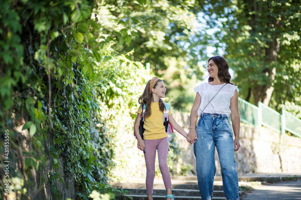 Little girl walking to school with her mother. Little girl walking to school with her mother.