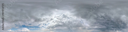 Seamless cloudy dark sky before storm hdri panorama 360 degrees angle view with beautiful clouds with zenith for use in 3d graphics as sky dome or edit drone shot.