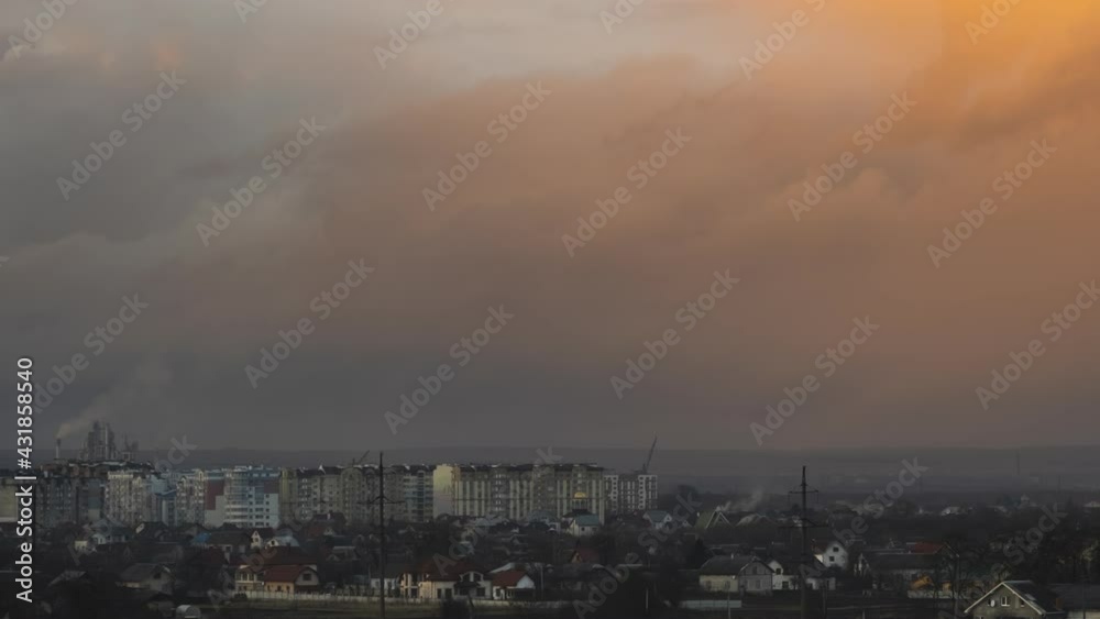 Time lapse of fast moving stormy clouds on dark yellow sky at sunset. Time lapse of fast moving stormy clouds on dark yellow sky at sunset.