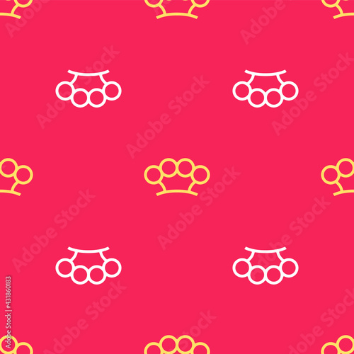Yellow Brass knuckles icon isolated seamless pattern on red background. Vector