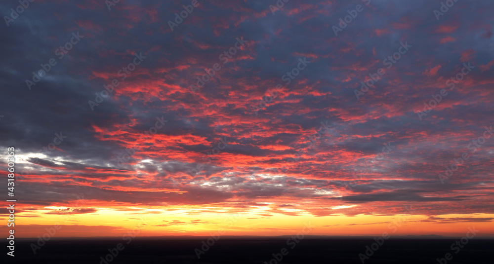 Fototapeta premium Only sky at sunset, abstract view with red and orange clouds