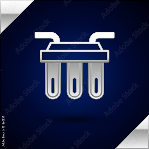 Silver Water filter icon isolated on dark blue background. System for filtration of water. Reverse osmosis system. Vector