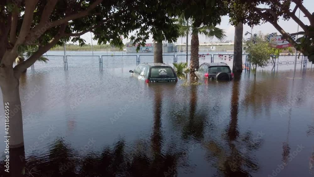 Cars submerged in floodwaters. Depiction of flooding after a hurricane ...