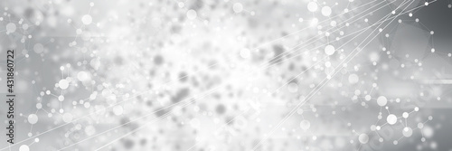 White circle light on gray smooth backdrop or silver snowflake background. 