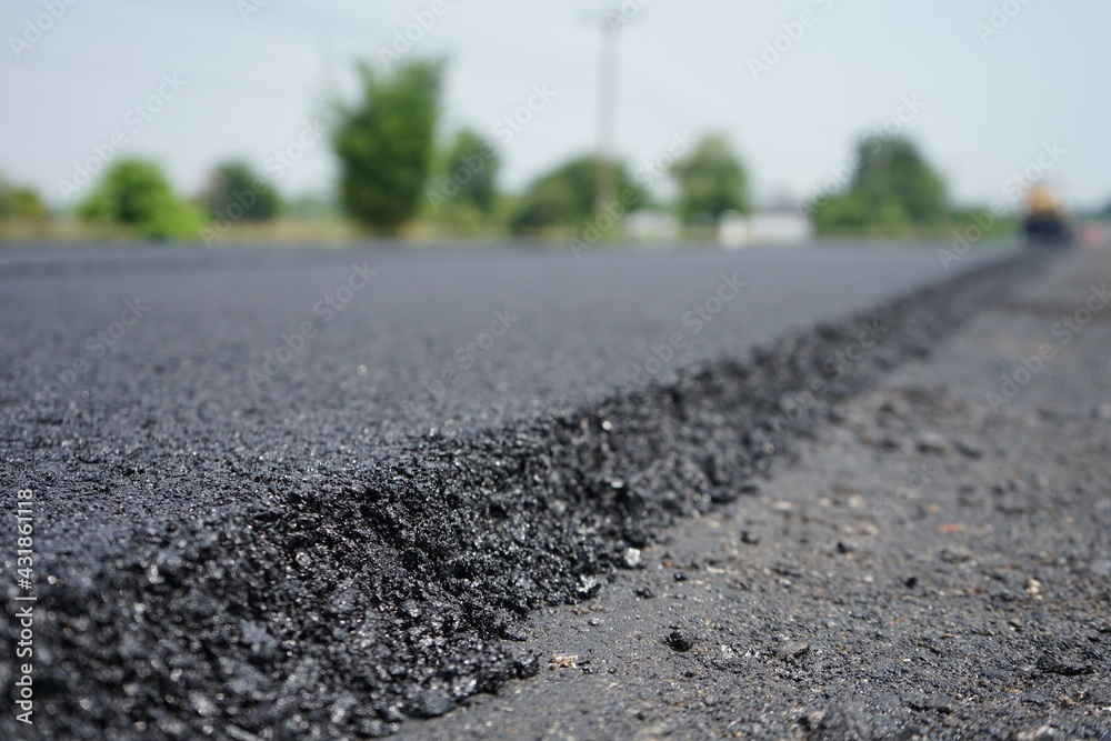 The image is blurred in the construction of asphalt road. The image is blurred in the construction of asphalt road.