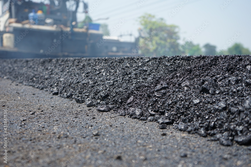 The image is blurred in the construction of asphalt road. The image is blurred in the construction of asphalt road.