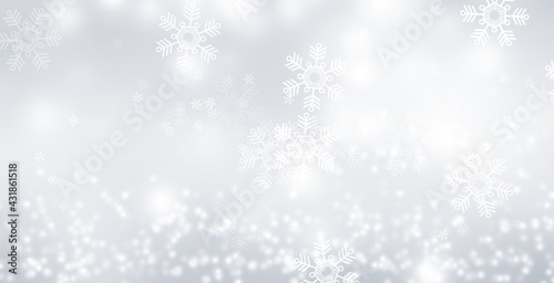 White circle light on gray smooth backdrop or silver snowflake background. 