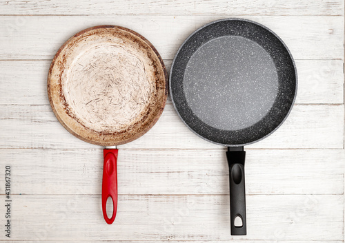 Comparison of pans. Old and new frying pan. New and old damaged non-stick coating. photo