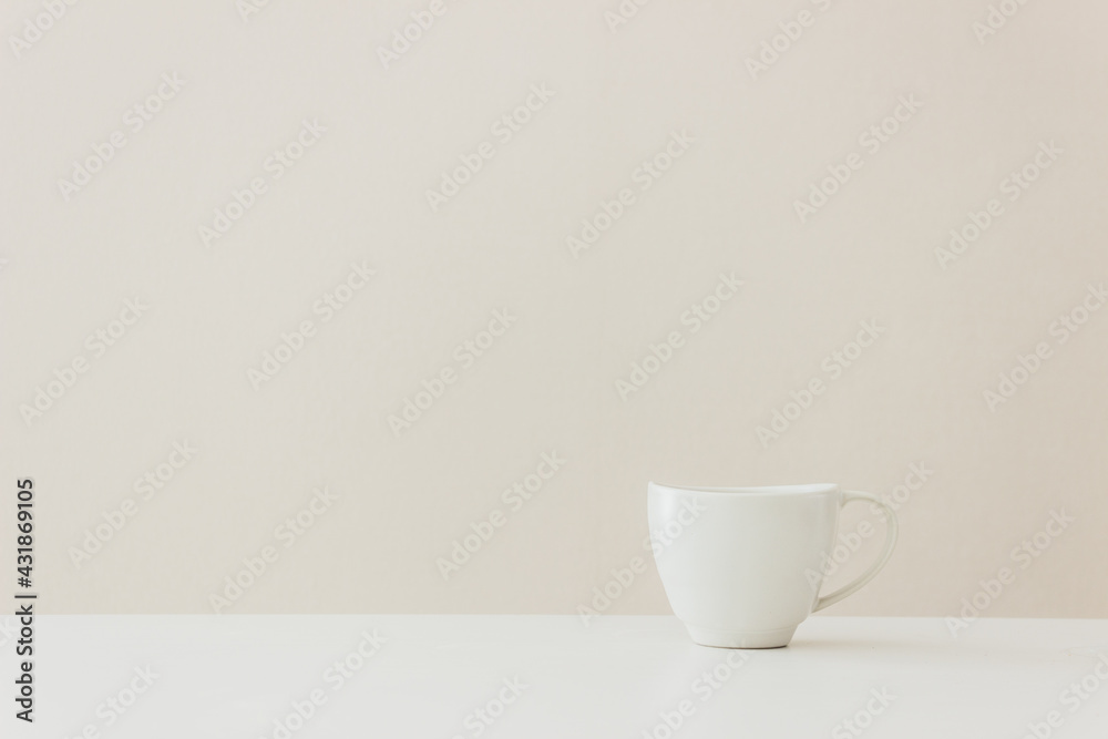 A white cup of coffee on table A white cup of coffee on table