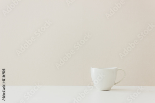 A white cup of coffee on table
