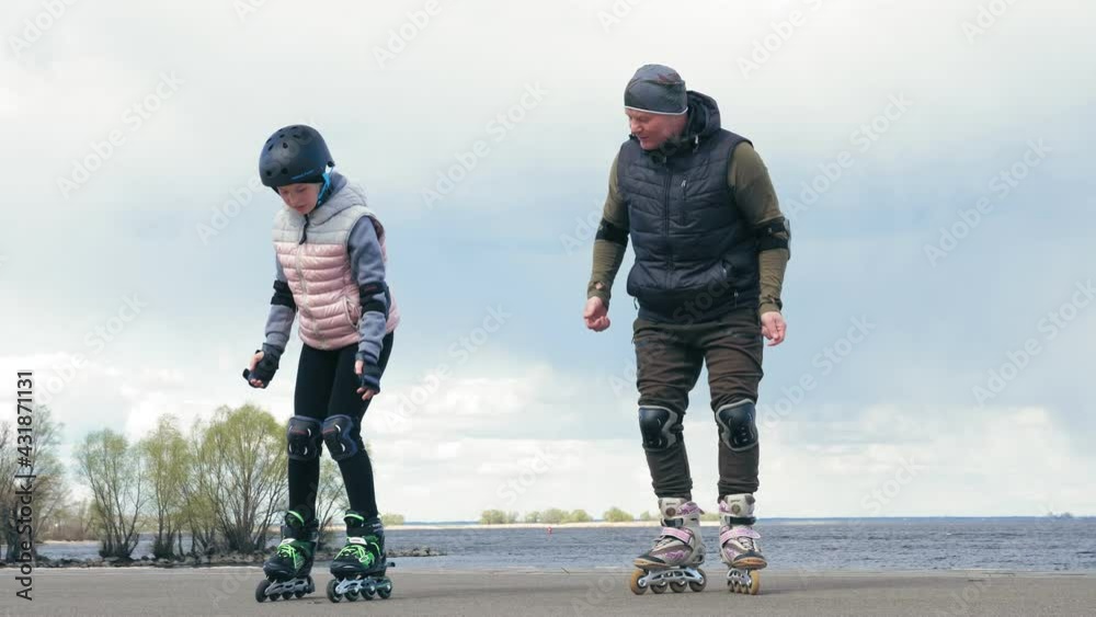 roller skating outdoors. rollerblading outdoors. teenage girl is