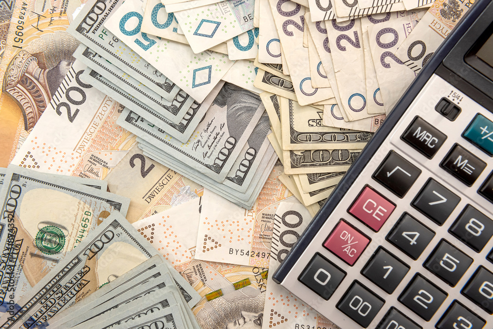 Naklejka premium polish money and calculator as business and exchange concept