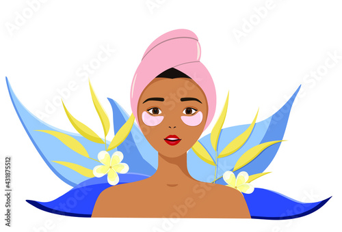 A young girl with a towel on her head and patches on her face. Care for yourself, for your body and face. Self-love