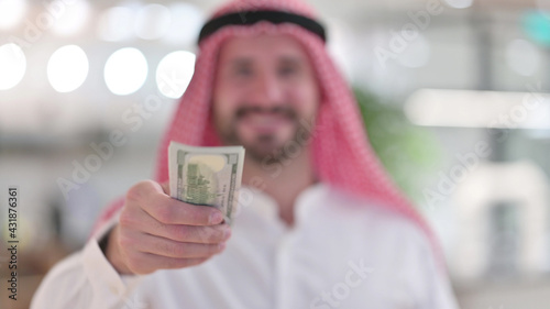 Arab Businessman Offering Dollars, Financial Investment