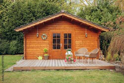 Fototapet Small wooden hut in the garden