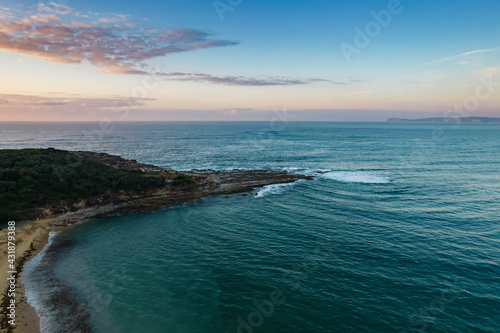 Aerial sunrise seascape with headland and national park