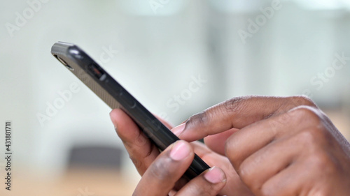 Close Up of African Man Using Smartphone
