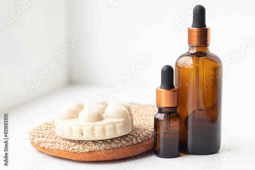 Bottles with oil, massage mitten and soap. Aroma therapy, beauty salon and hammam concept.