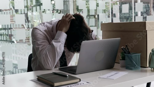 Put the work equipment in the office in a large brown box, Businessmen are keeping work documents and personal belongings due to resignation or being fired, termination of employment.