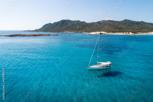 ITALY - Sardinia - Sailboat at anchor at the Capo Comino beach on the east coast of Sardinia