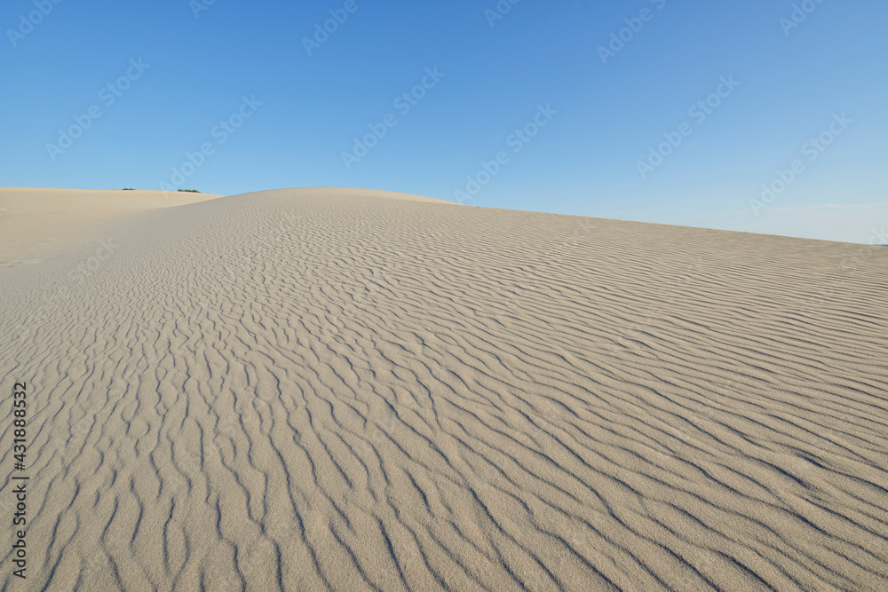 Italy - Sardinia - Panoramic view with grazing light from the top of the white sand dunes of Porto Pino in southern Sardinia Italy - Sardinia - Panoramic view with grazing light from the top of the white sand dunes of Porto Pino in southern Sardinia