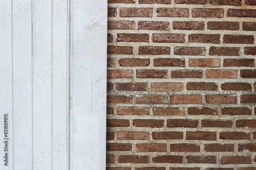 A brick wall and white wooden background