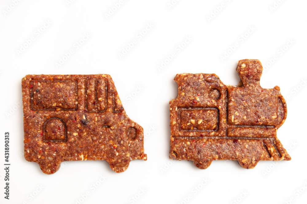 Raw vegan brown cookies on white. less sugar consumption. Raw vegan brown cookies on white. less sugar consumption.