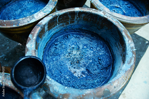 Indigo water, Indigo plant fermentation in clay pots photo