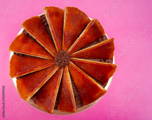 Dobos torte with shiny layer - cake from above - isolated on pink photo