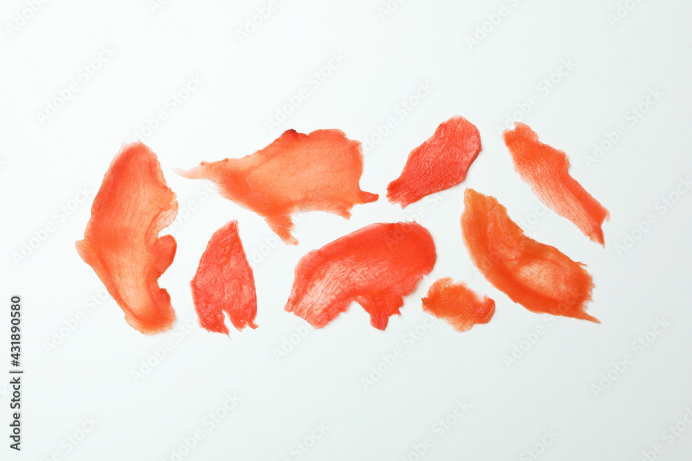 Red pickled ginger slices on white background Red pickled ginger slices on white background