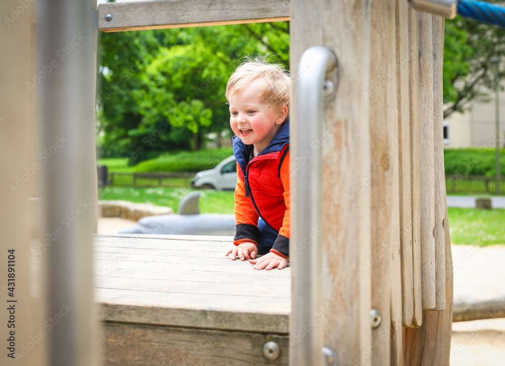 Walking father and son on the playground in the park. Walking father and son on the playground in the park.