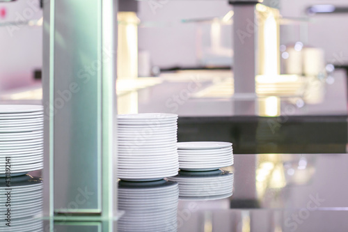 Plates on a metal countertop. Commercial kitchen