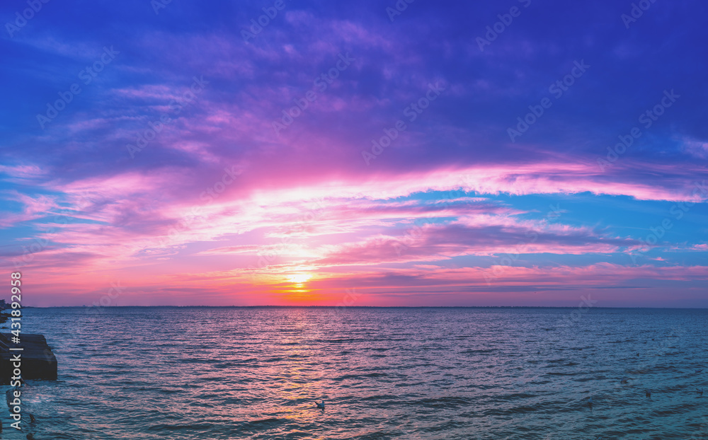 Seascape with fantastic beautiful sky in the evening. Sunset over the sea