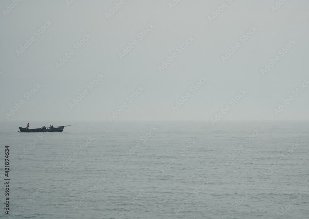 fishing boat in a foggy morning.