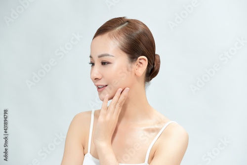Attractive beautiful Asia girl get happiness and relaxed because she gets satisfied of face skin, smile face