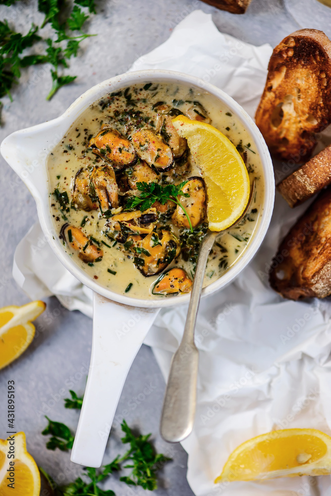 mussels in creamy sauce in a frying pan.top view mussels in creamy sauce in a frying pan.top view