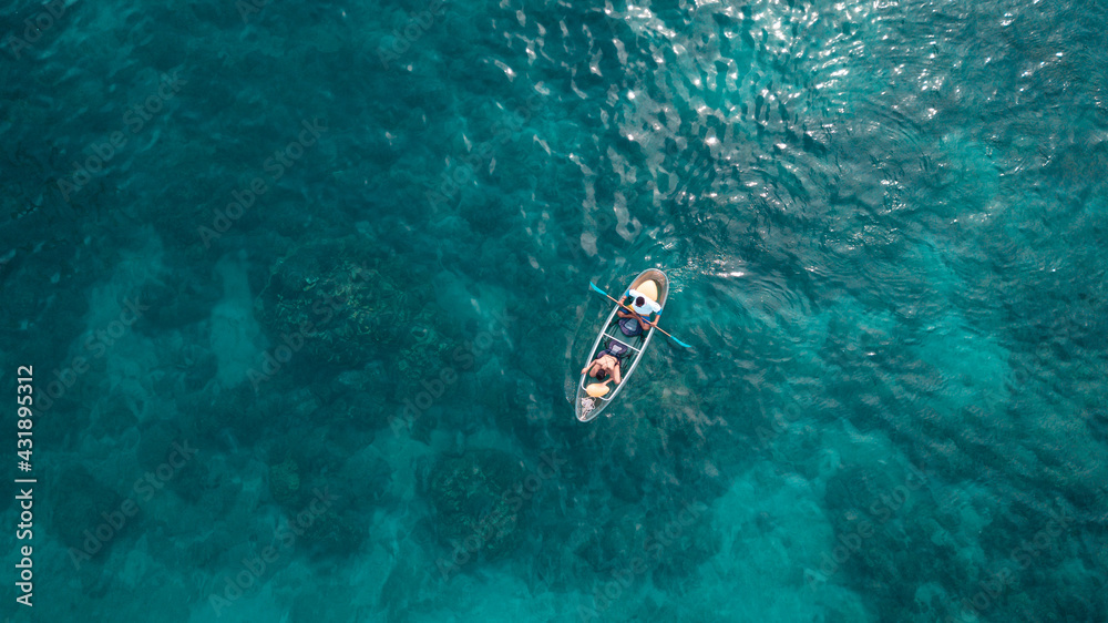 Tourist sail kayak on the sea, with top view from drone.