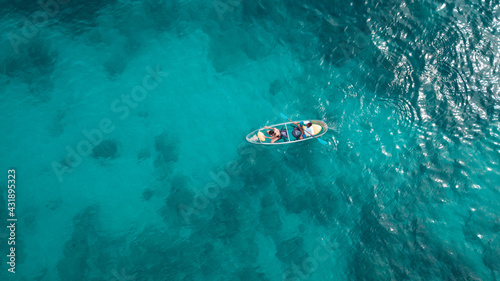 Tourist sail kayak on the sea, with top view from drone. © TeeRaiden