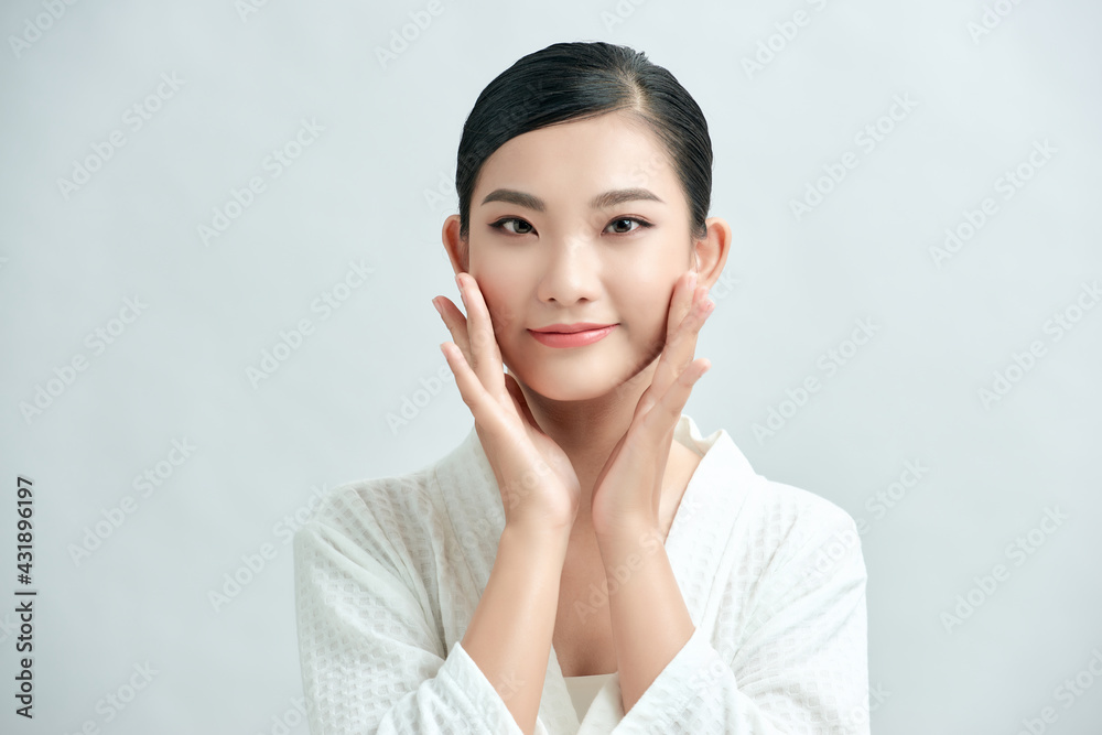 asian young beautiful woman smiling and touching her face, isolated over white background asian young beautiful woman smiling and touching her face, isolated over white background