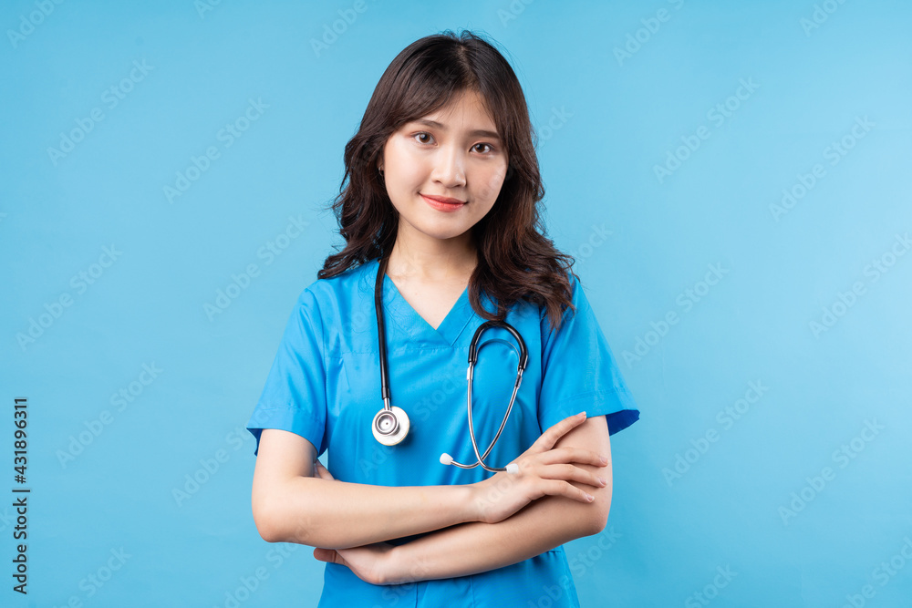 Portrait of young female doctor smiling happily on background Portrait of young female doctor smiling happily on background