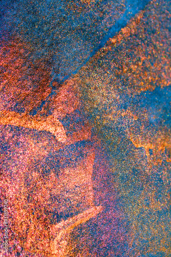 Blue and Bronze Paint on a Textured Background