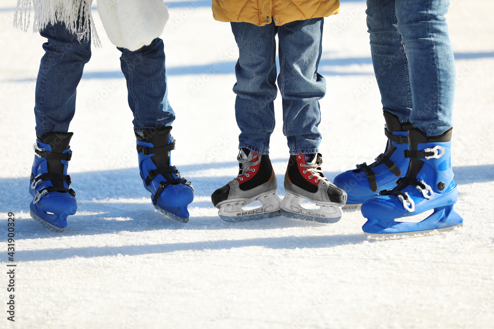 Family at outdoor ice skating rink, closeup Family at outdoor ice skating rink, closeup
